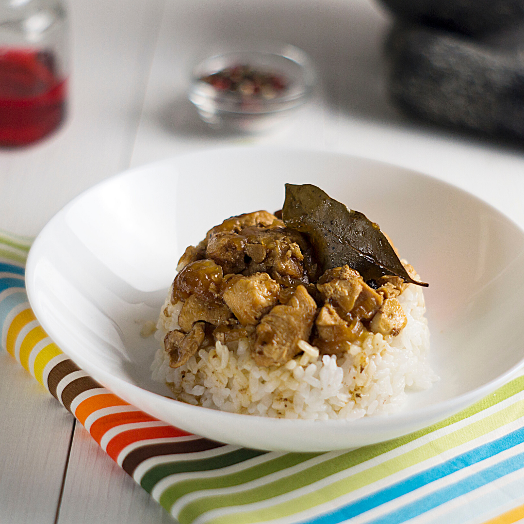 chicken adobo on rice with bayleaf
